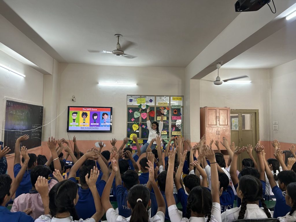 Animal welfare education session in a Rajasthan classroom, with students playing the SAFE game on avoiding dog bites
